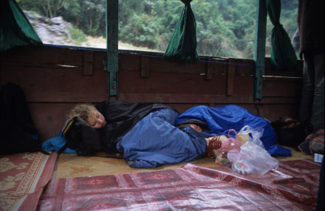 Backpackers Rest on the Boat Ride from Luang Prabang to Houay Xai