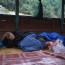 Backpackers Rest on the Boat Ride from Luang Prabang to Houay Xai